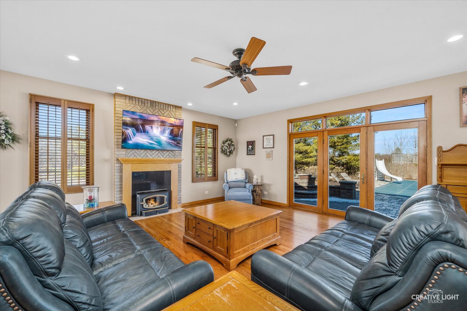 1651 Johnson Road Oswego, IL 60543 - Photo 7 of 60 a living room with furniture fireplace and a large window