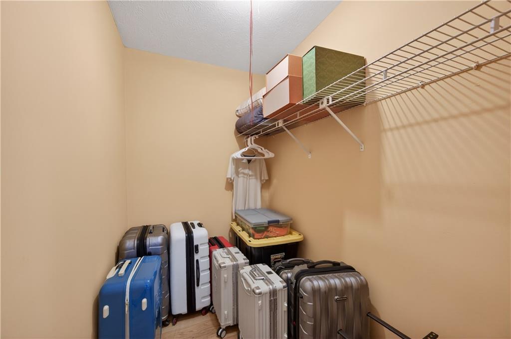 2878 Cardinal Trace Duluth, GA 30096 - Photo 18 of 42 a view of storage and utility room with racks on the wall