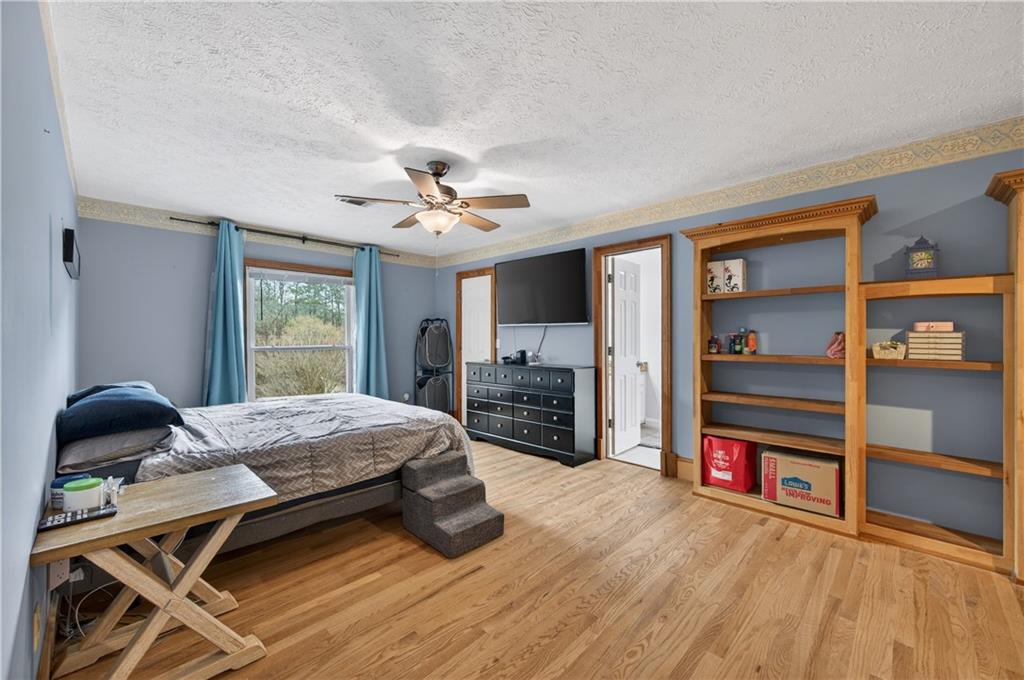 2878 Cardinal Trace Duluth, GA 30096 - Photo 22 of 42 a bedroom with furniture and window