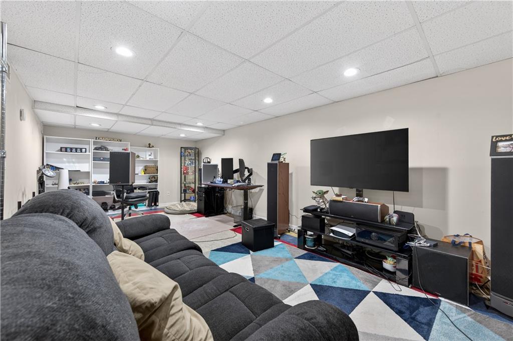 2878 Cardinal Trace Duluth, GA 30096 - Photo 28 of 42 a living room with furniture and a flat screen tv