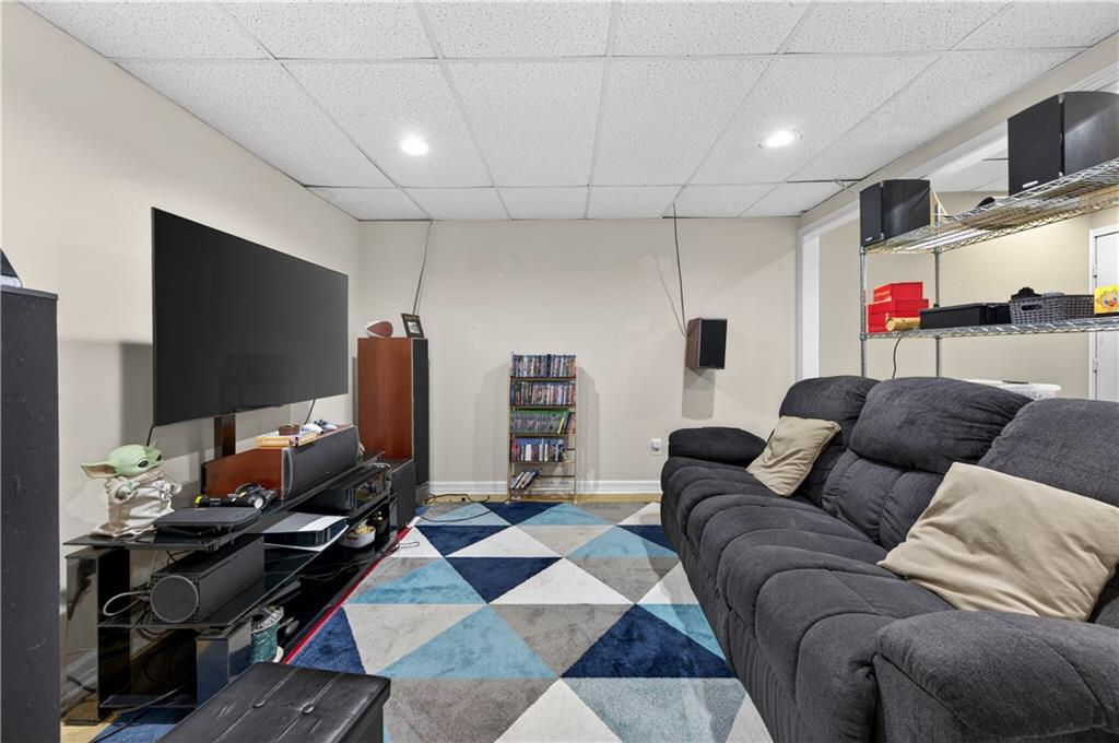 2878 Cardinal Trace Duluth, GA 30096 - Photo 30 of 42 a living room with furniture and a flat screen tv