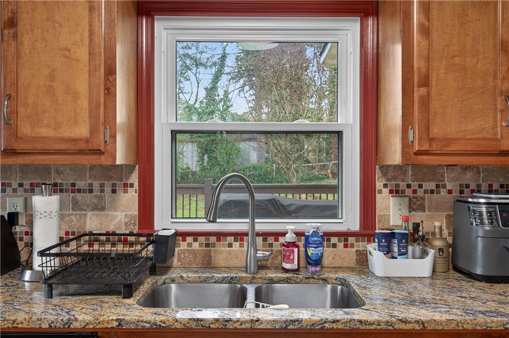 2878 Cardinal Trace Duluth, GA 30096 - Photo 8 of 42 a kitchen with sink a granite counter tops and a window