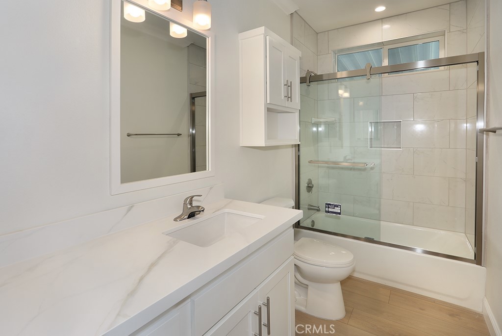 129 La Ronda Tustin, CA 92780 - Photo 11 of 33 a bathroom with a sink toilet and shower