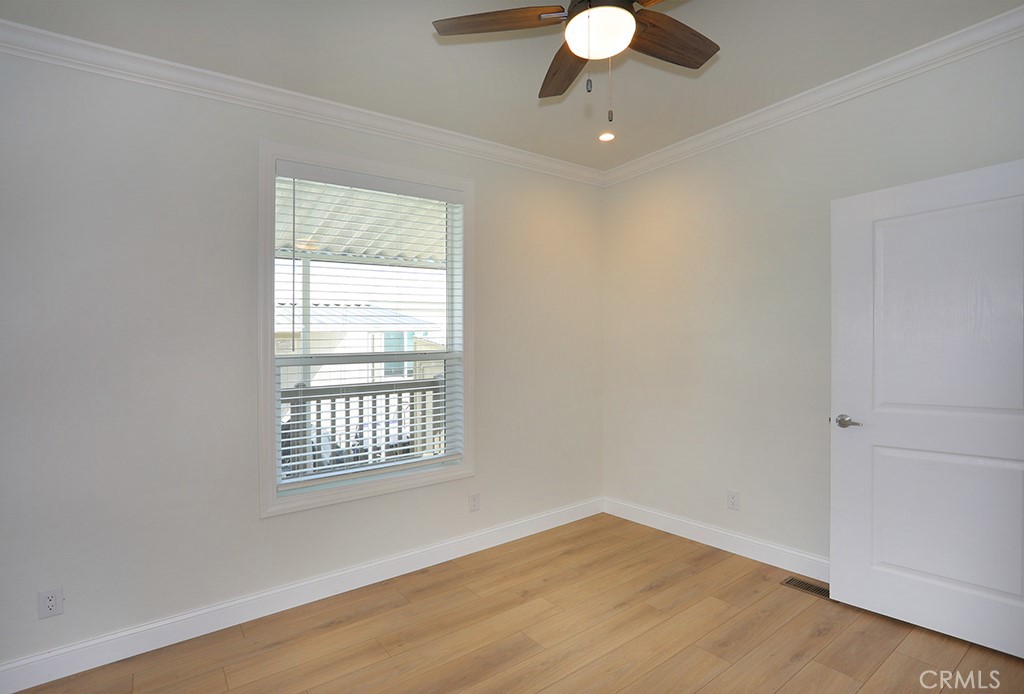 129 La Ronda Tustin, CA 92780 - Photo 13 of 33 wooden floor in an empty room with a window