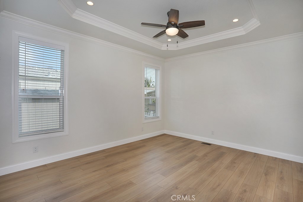 129 La Ronda Tustin, CA 92780 - Photo 25 of 33 a view of a big room with wooden floor and windows