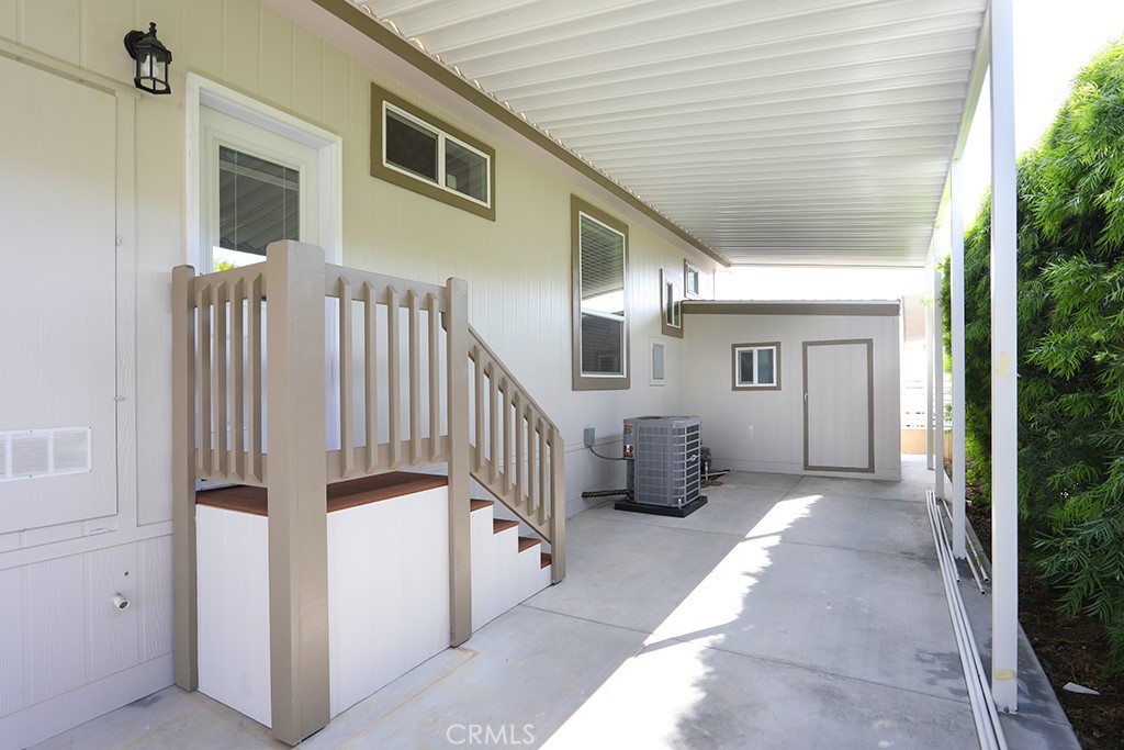 129 La Ronda Tustin, CA 92780 - Photo 29 of 33 a view of a porch with a bench