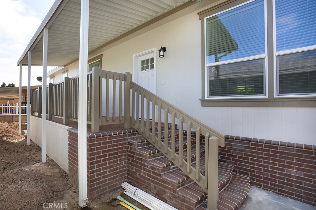 129 La Ronda Tustin, CA 92780 - Photo 30 of 33 a view of a balcony with wooden floor and fence