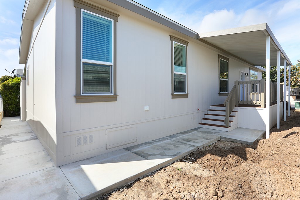 129 La Ronda Tustin, CA 92780 - Photo 32 of 33 a view of a house with a backyard