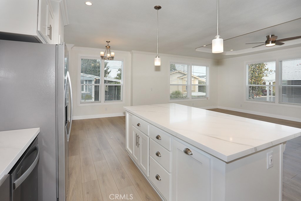 129 La Ronda Tustin, CA 92780 - Photo 9 of 33 a large white kitchen with a window