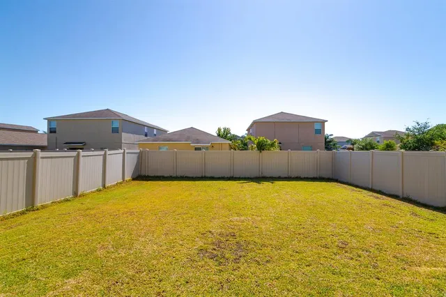 a view of an outdoor space and basketball court