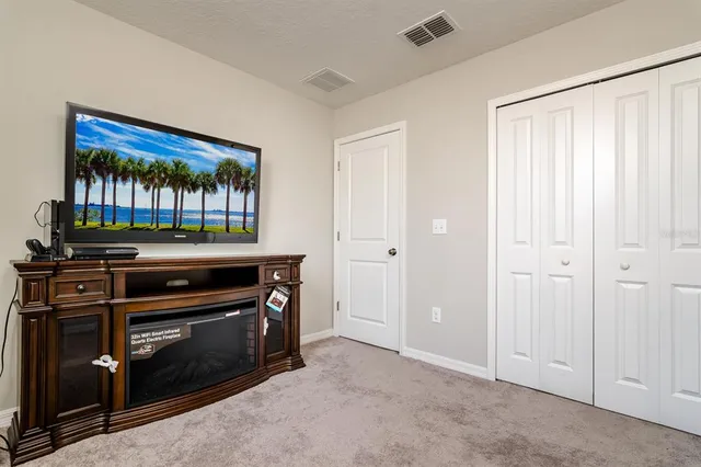 a kitchen with a stove and a cabinet