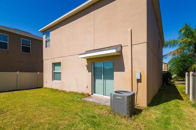 a backyard of a house with seating space