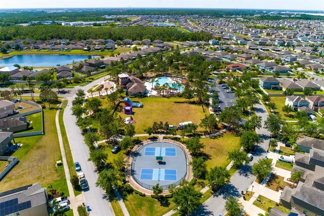 an aerial view of residential houses with outdoor space