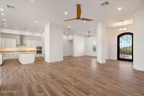 a view of a kitchen with a sink and a refrigerator