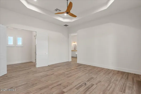 a bathroom with a double vanity sink a mirror and a bathtub