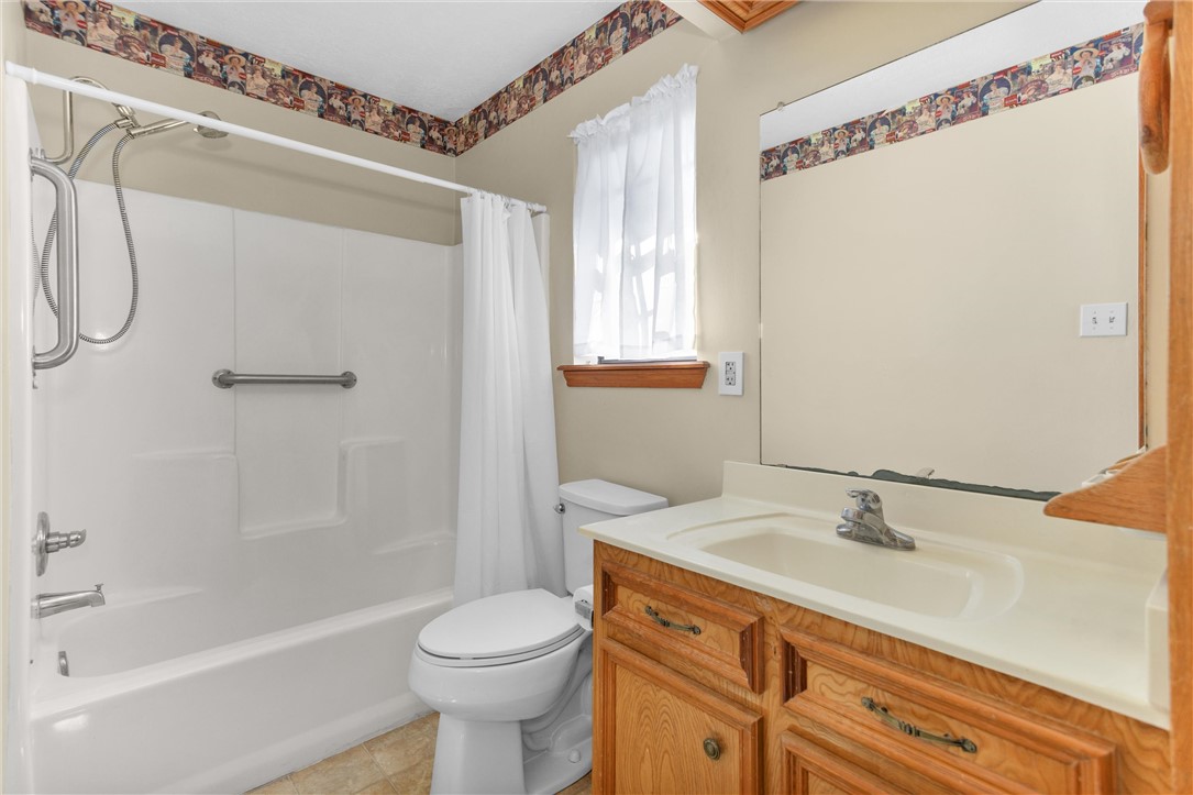 1706 Shawnee Street Navasota, TX 77868 - Photo 19 of 25 a bathroom with a sink a toilet and shower