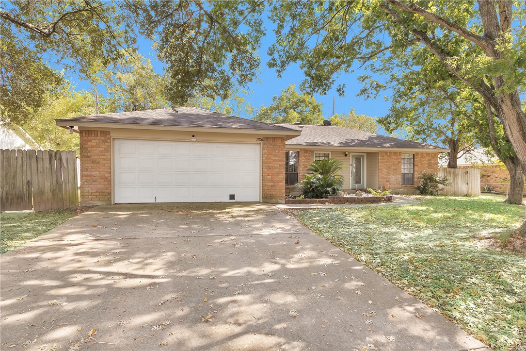 1706 Shawnee Street Navasota, TX 77868 - Photo 2 of 25 a front view of a house with a garden
