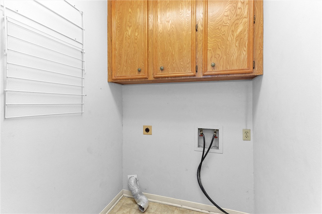 1706 Shawnee Street Navasota, TX 77868 - Photo 22 of 25 a bathroom with a sink and a mirror