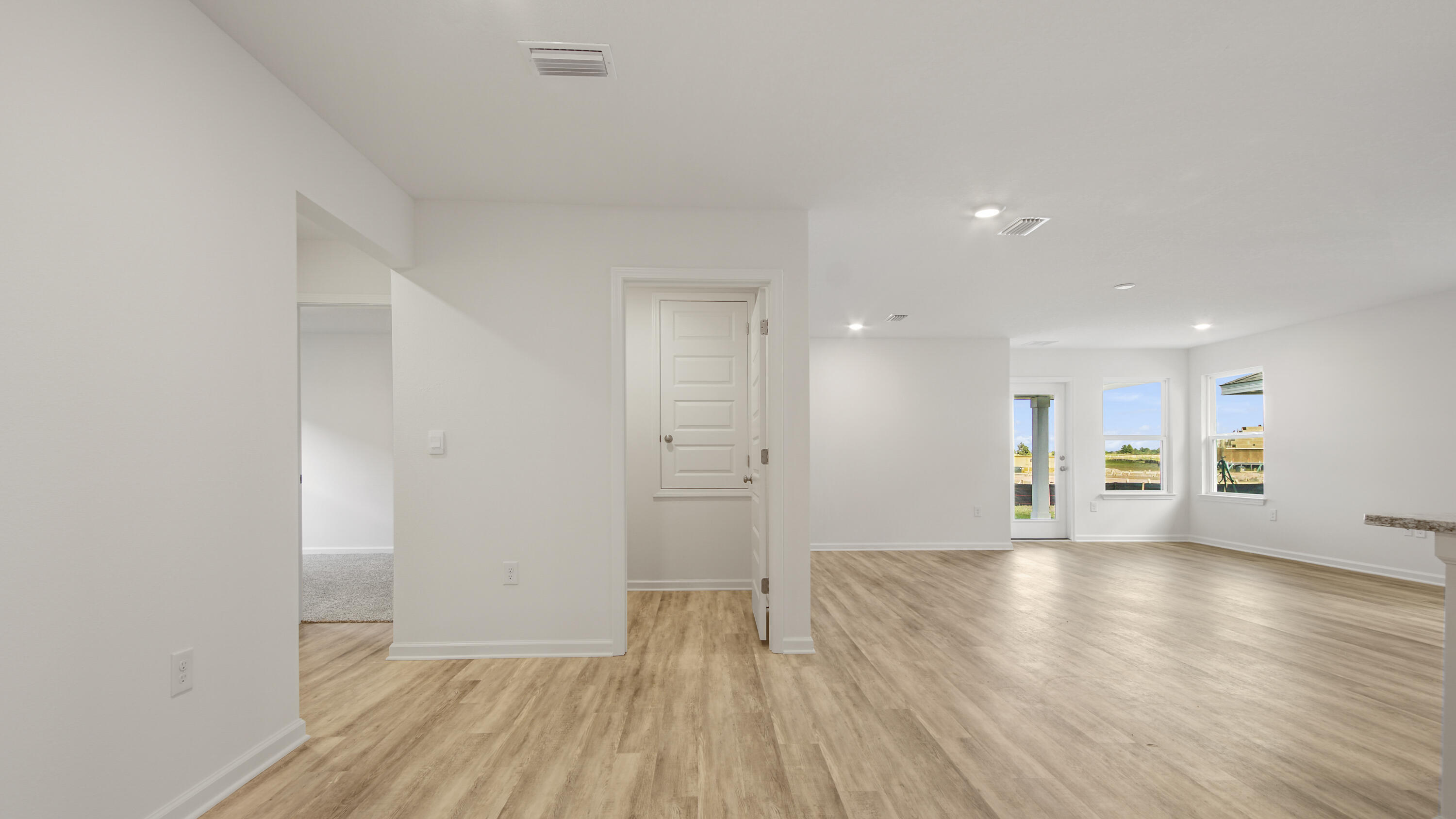 234 Gray Owl Drive Freeport, FL 32439 - Photo 13 of 37 a view of an empty room with wooden floor