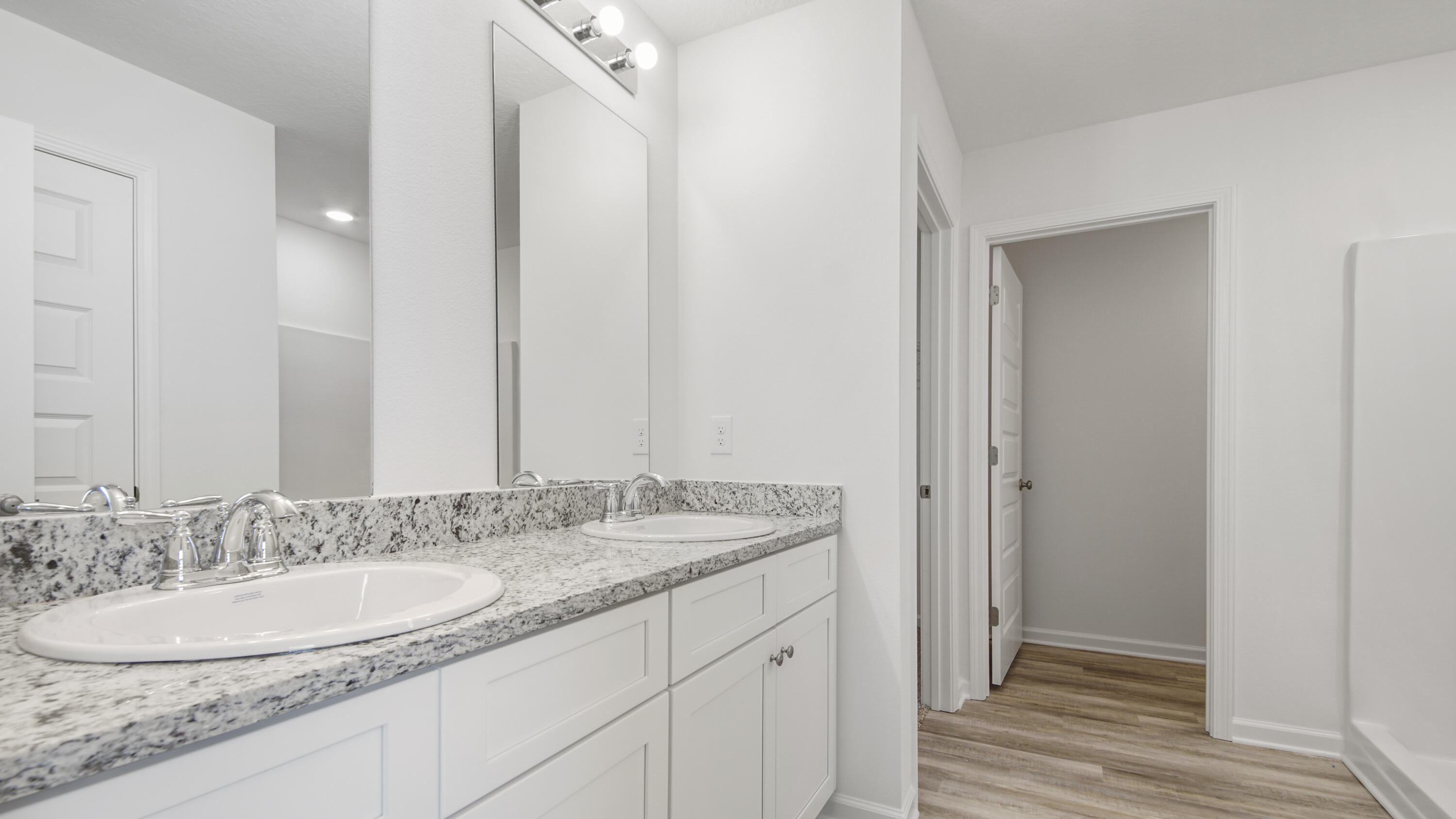234 Gray Owl Drive Freeport, FL 32439 - Photo 17 of 37 a bathroom with a granite countertop double vanity sink and a mirror