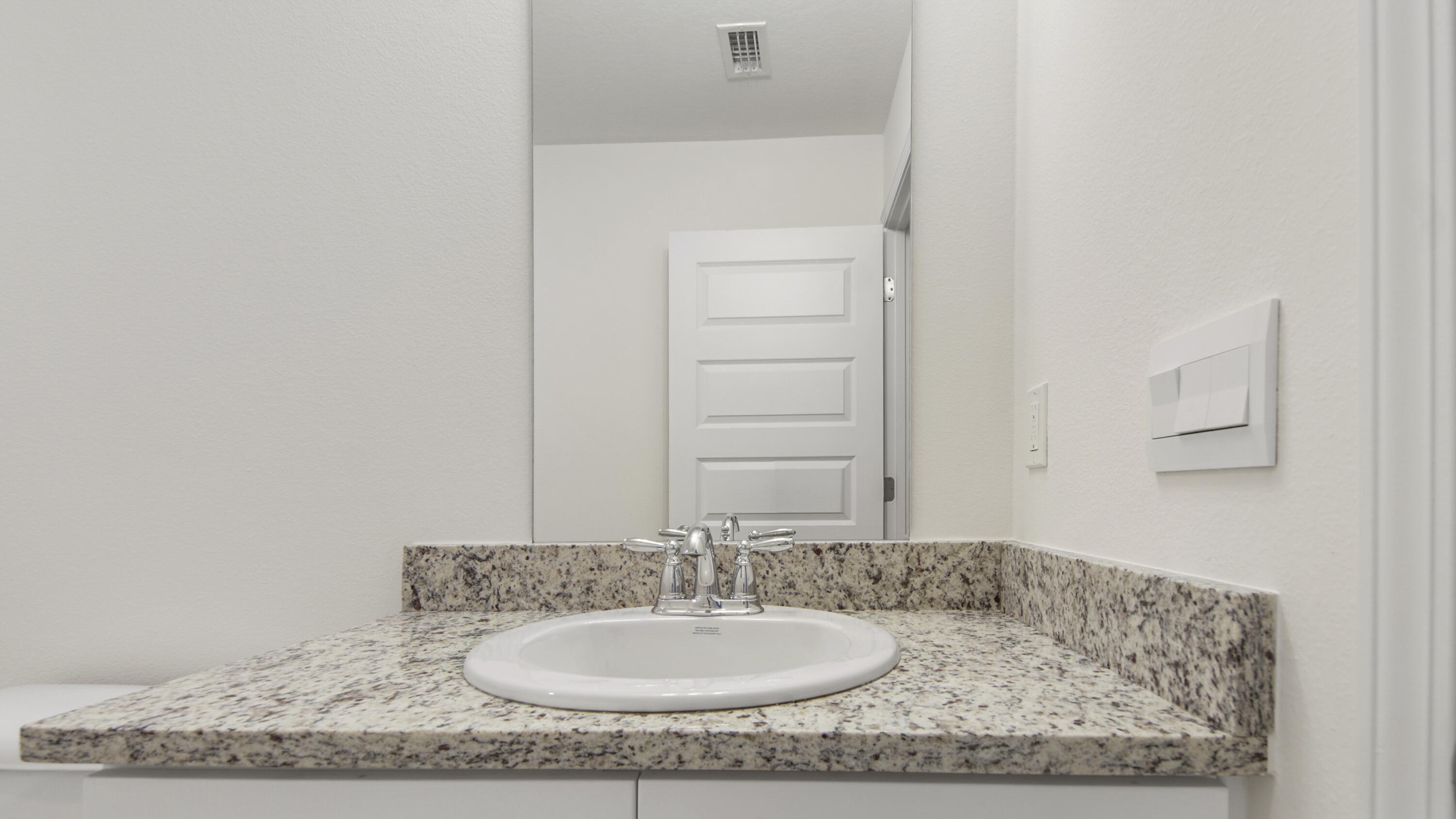 234 Gray Owl Drive Freeport, FL 32439 - Photo 28 of 37 a bathroom with a granite countertop sink and a mirror