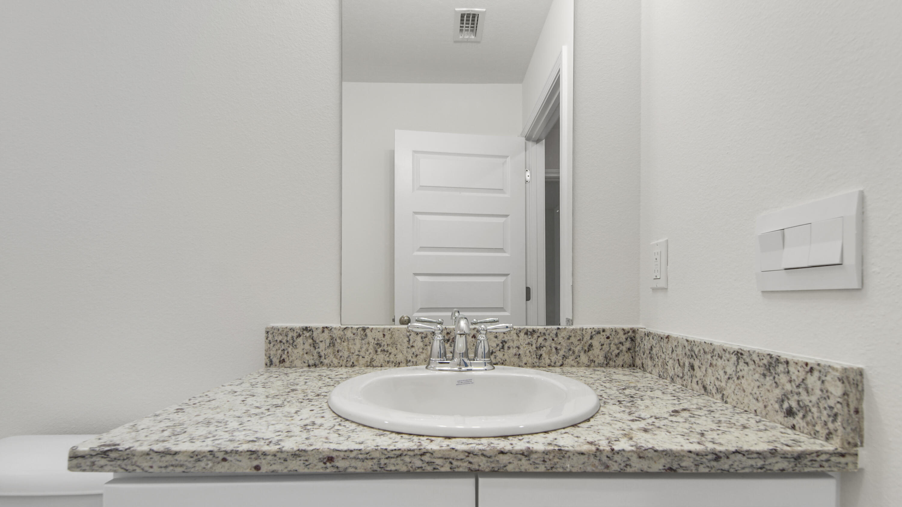 234 Gray Owl Drive Freeport, FL 32439 - Photo 33 of 37 a bathroom with a granite countertop sink and a mirror