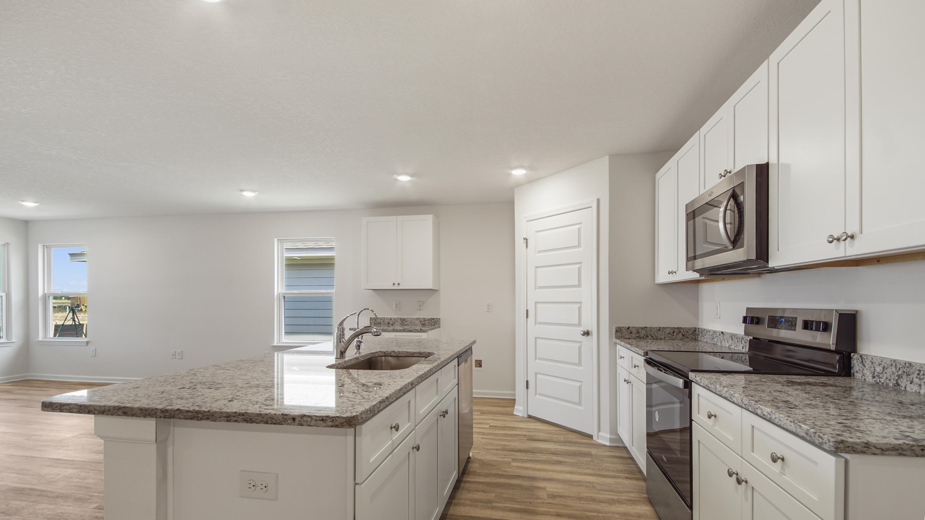 234 Gray Owl Drive Freeport, FL 32439 - Photo 4 of 37 a kitchen with stainless steel appliances granite countertop a sink stove and cabinets