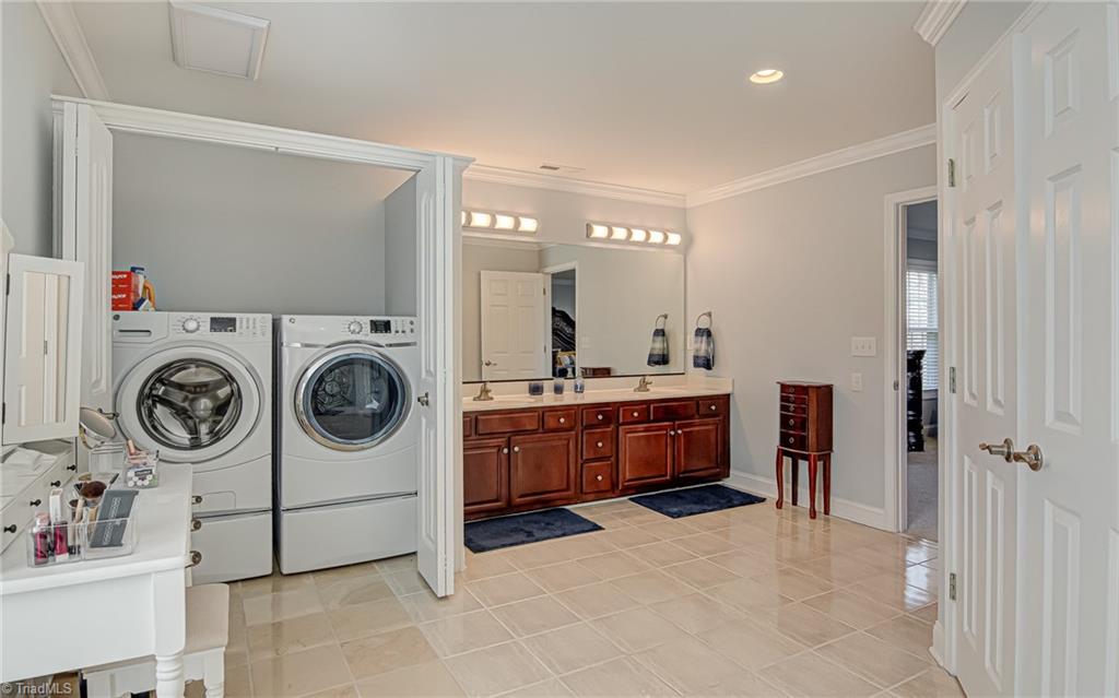 7098 Falcon Way Trinity, NC 27370 - Photo 27 of 45 primary bathroom with laundry