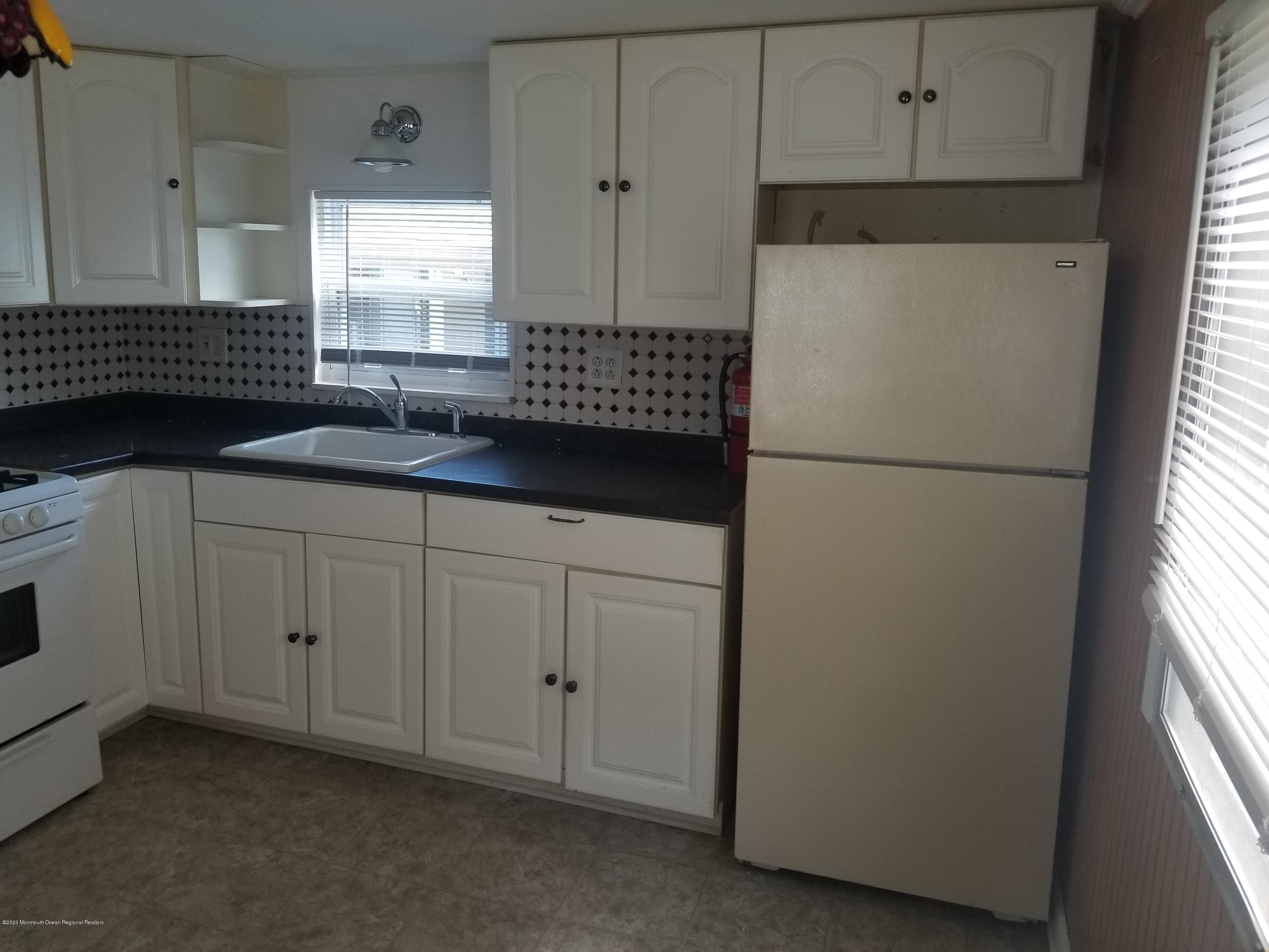 5 Antonia Drive Jackson, NJ 08527 - Photo 2 of 8 a white refrigerator freezer sitting in a kitchen