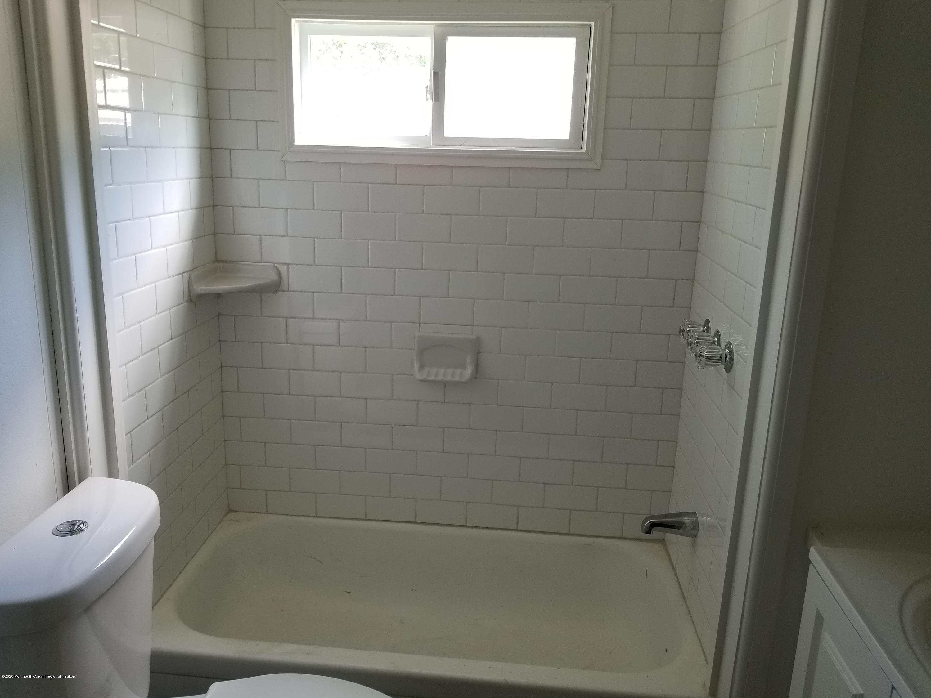 5 Antonia Drive Jackson, NJ 08527 - Photo 6 of 8 a bathroom with a tub and a shower