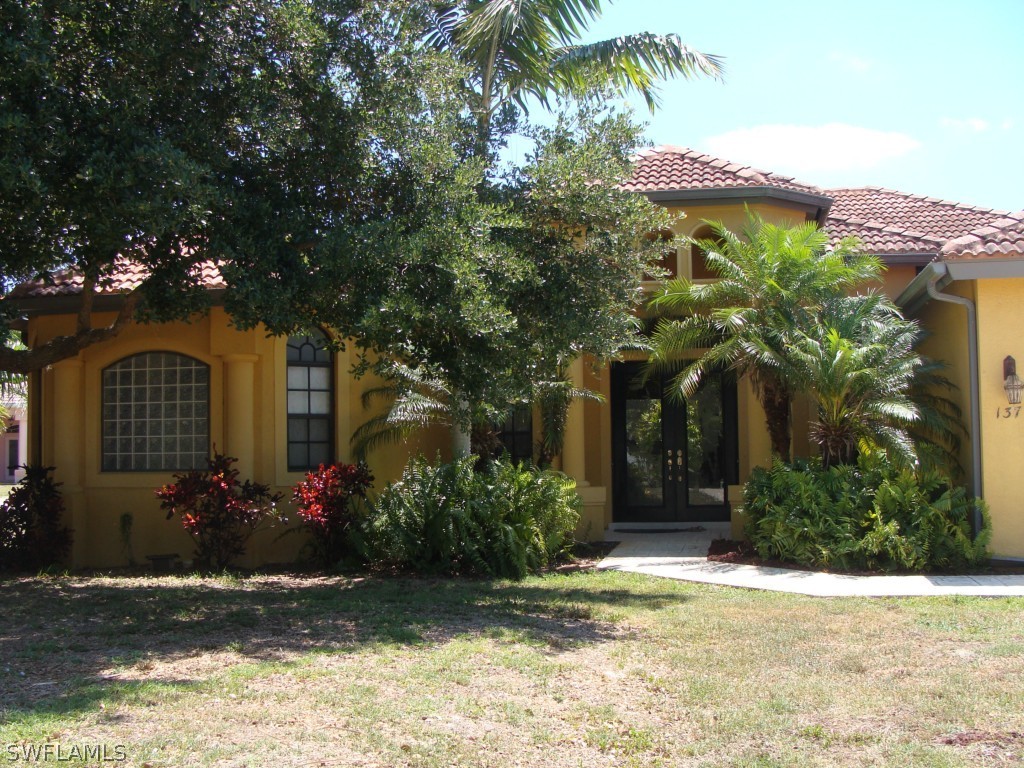 a front view of a house with a yard