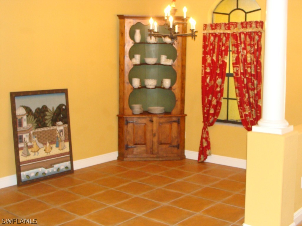 13710 Robert Road Bokeelia, FL 33922 - Photo 13 of 24 a bathroom with a shower and a mirror