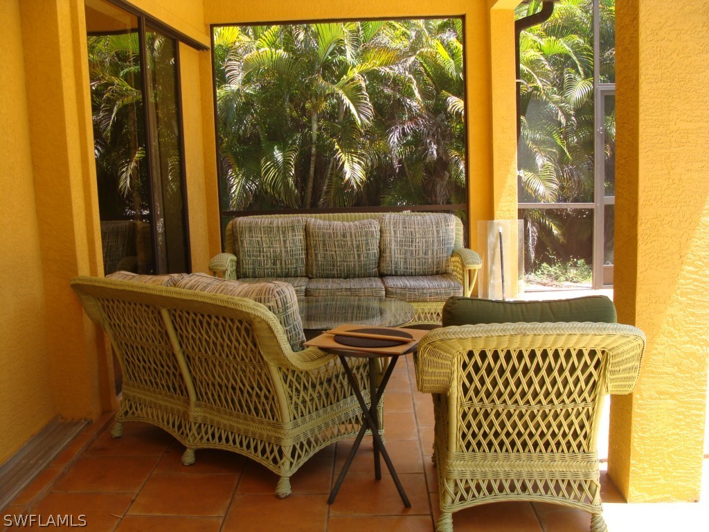 13710 Robert Road Bokeelia, FL 33922 - Photo 16 of 24 a view of a porch with furniture