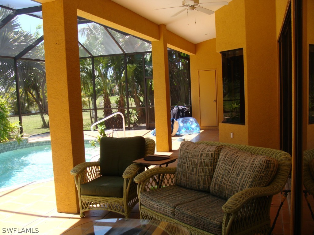13710 Robert Road Bokeelia, FL 33922 - Photo 17 of 24 a living room with furniture and a window