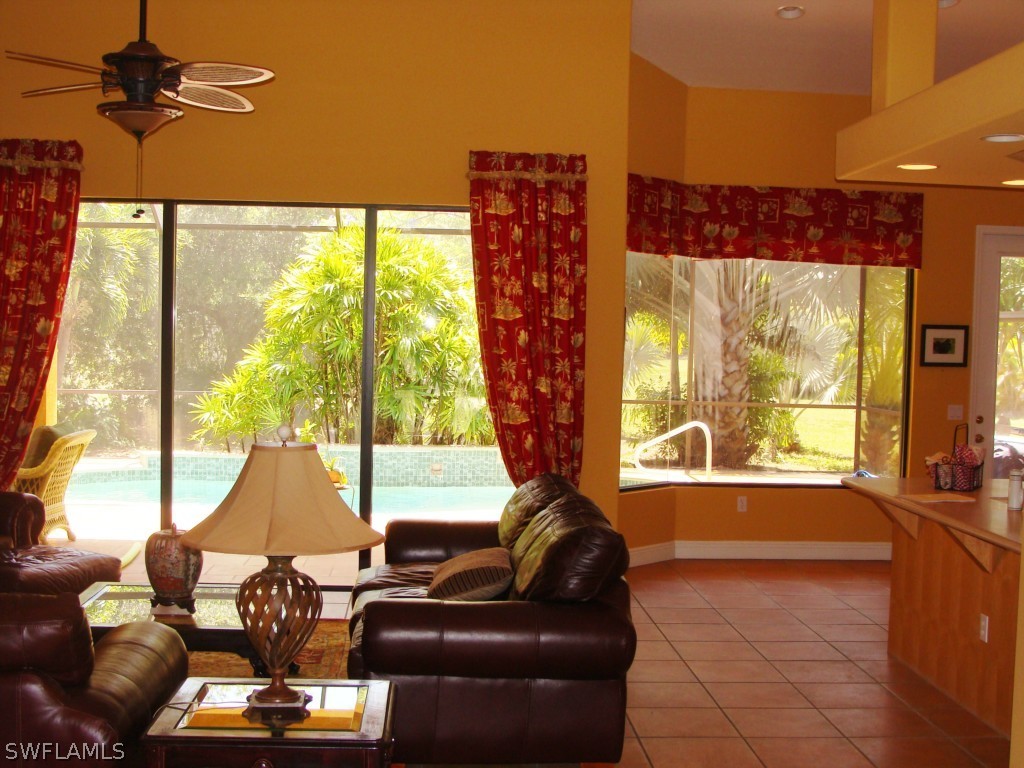 13710 Robert Road Bokeelia, FL 33922 - Photo 2 of 24 a living room with furniture and a large window