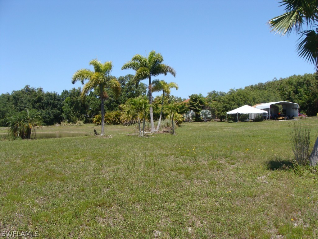 13710 Robert Road Bokeelia, FL 33922 - Photo 22 of 24 a view of a golf course with a garden