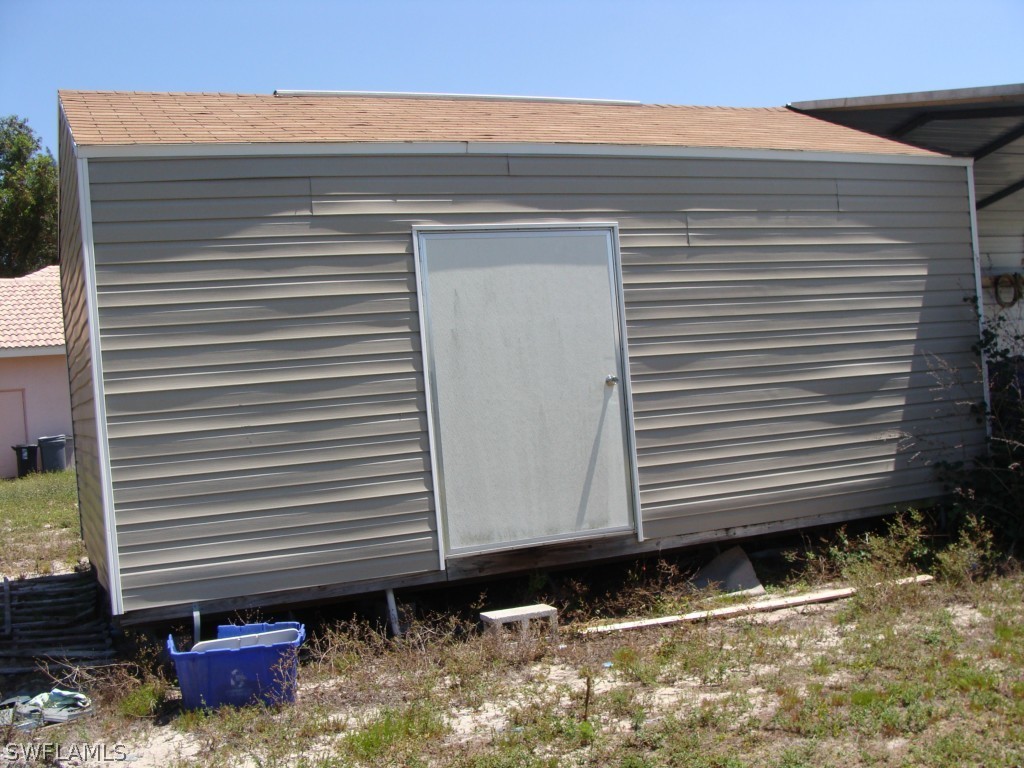 13710 Robert Road Bokeelia, FL 33922 - Photo 24 of 24 a front view of a house with garage