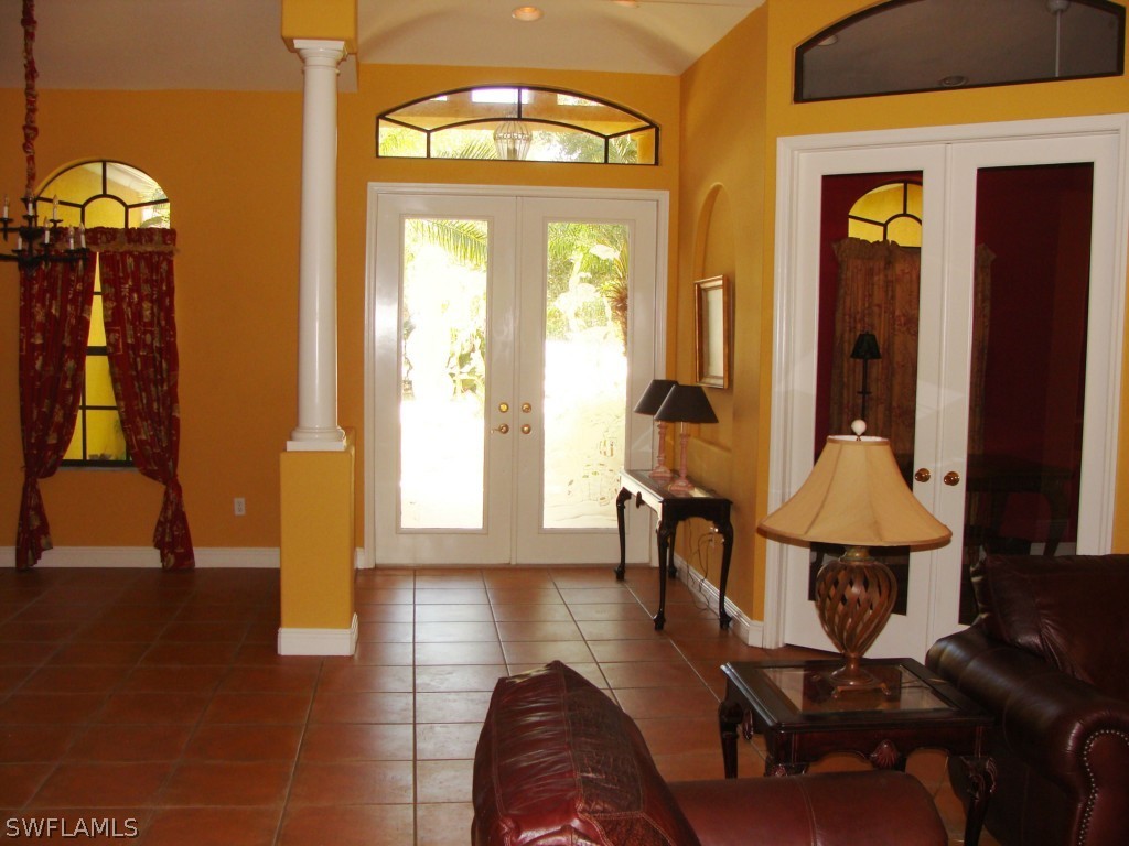 13710 Robert Road Bokeelia, FL 33922 - Photo 4 of 24 a living room with furniture and a window