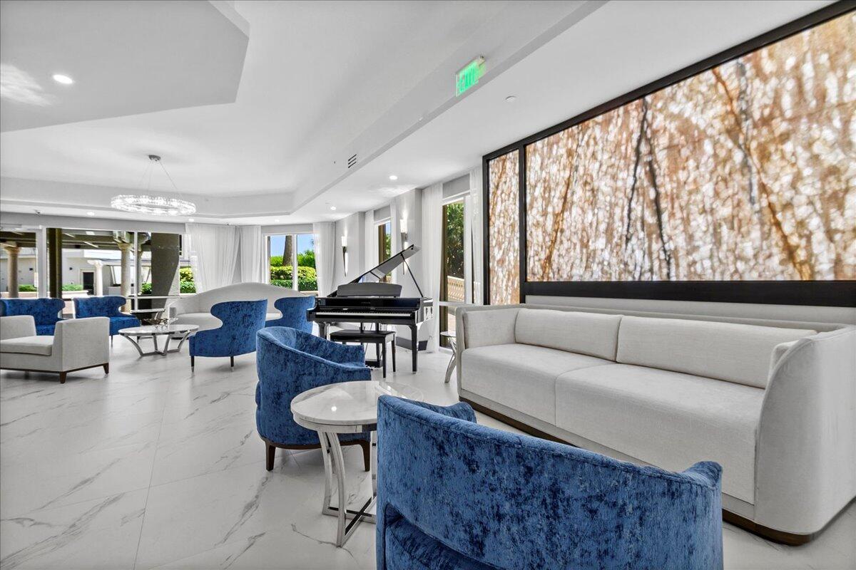 3920 North Ocean Drive, Unit 11B Singer Island, FL 33404 - Photo 42 of 58 a living room with furniture and a large window