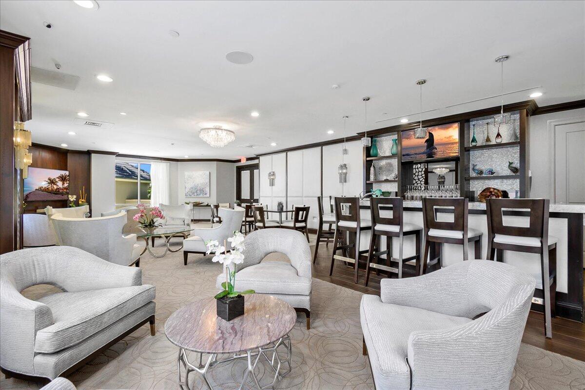 3920 North Ocean Drive, Unit 11B Singer Island, FL 33404 - Photo 45 of 58 a living room with furniture kitchen view and a large window