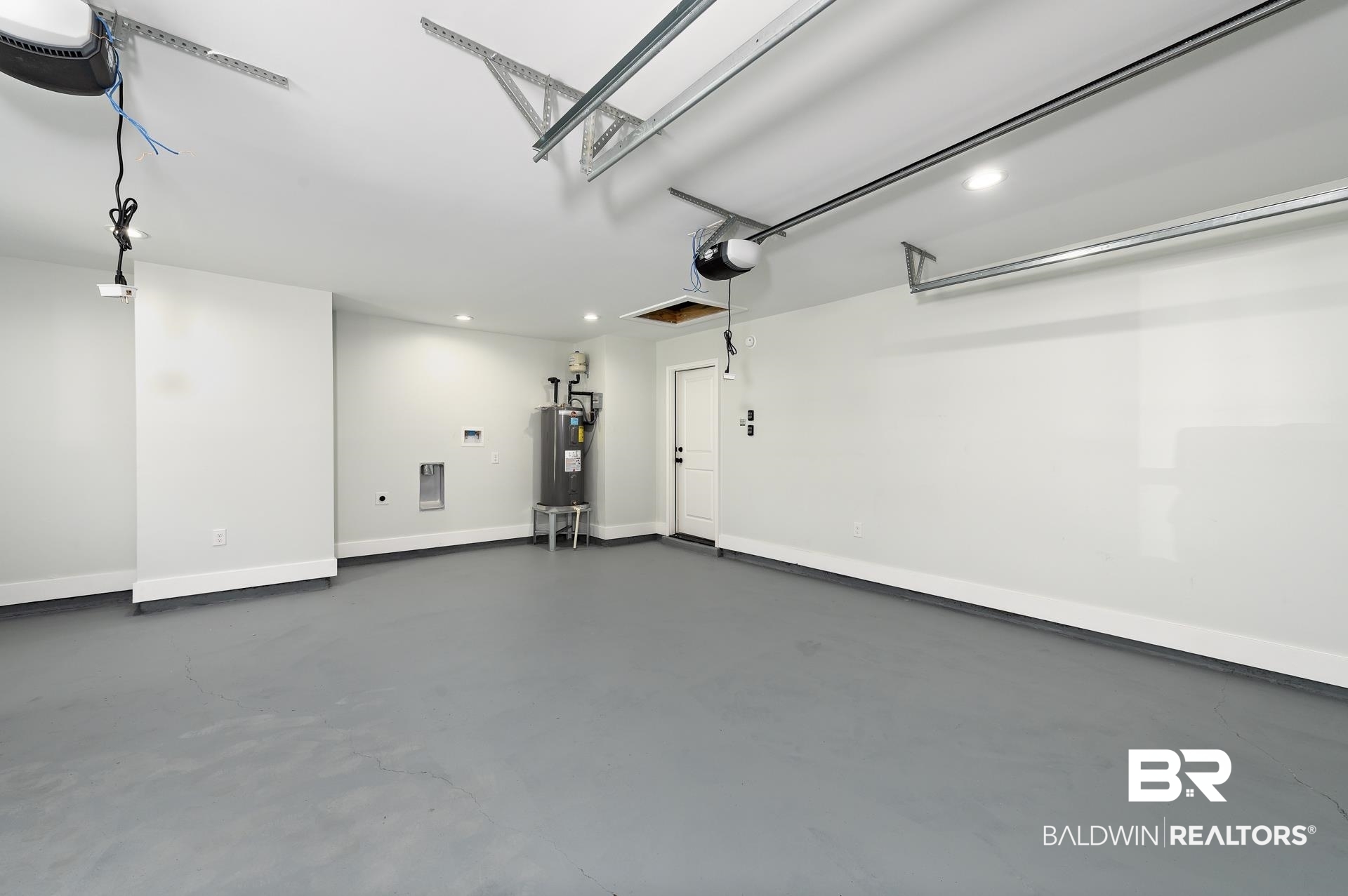 6001 Camp Halls Mill Road Mobile, AL 36619 - Photo 43 of 52 Garage with a garage door opener, recessed lighting, and electric water heater