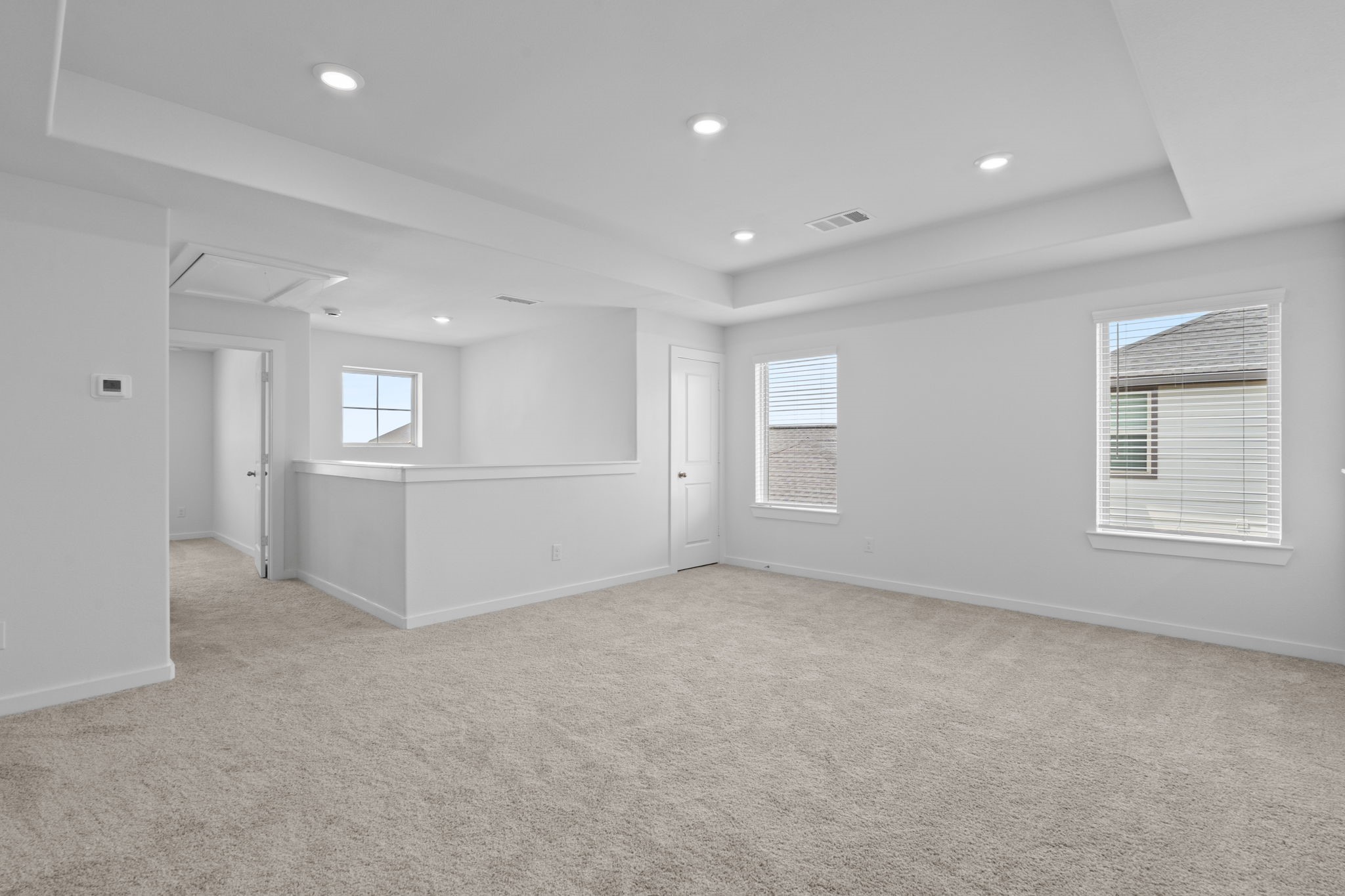 332 Gambels Quail Road Waller, TX 77484 - Photo 14 of 27 an empty room with windows and pillars in it