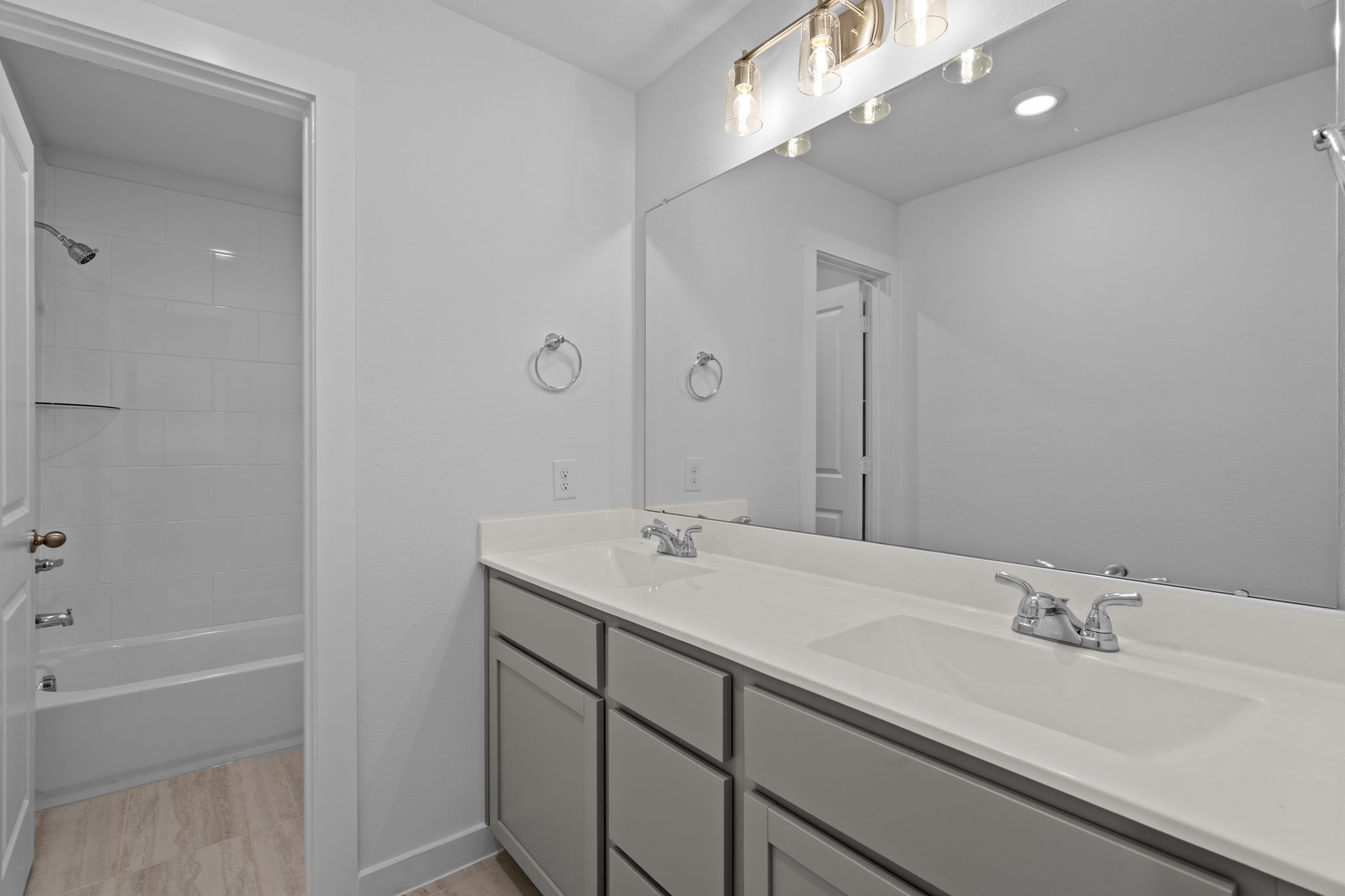 332 Gambels Quail Road Waller, TX 77484 - Photo 24 of 27 a bathroom with a sink double vanity and a mirror