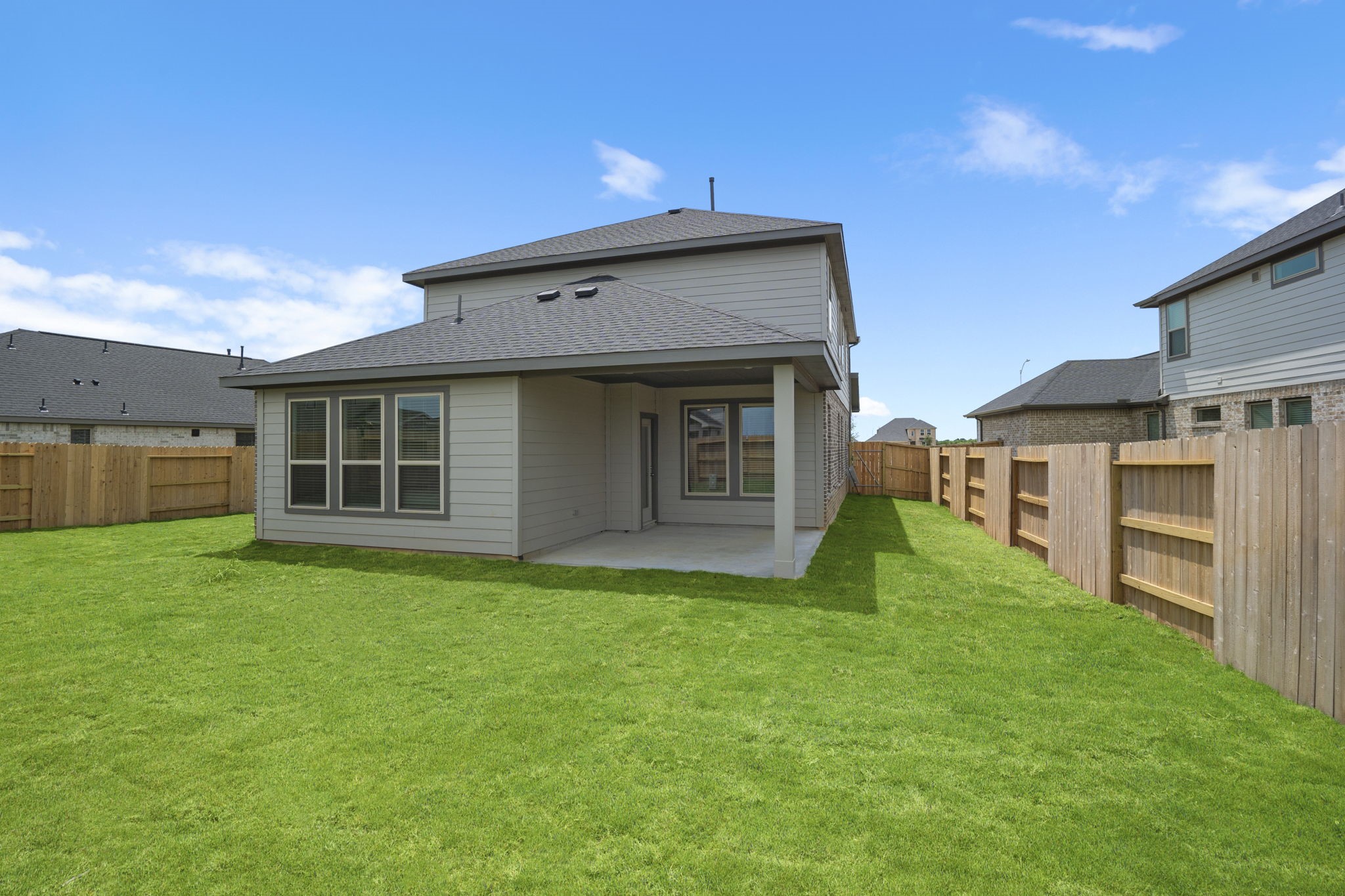 332 Gambels Quail Road Waller, TX 77484 - Photo 26 of 27 a view of a house with a backyard