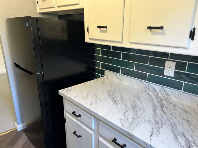 a bathroom with a sink a mirror and vanity