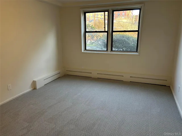 a living room with fireplace furniture and a window