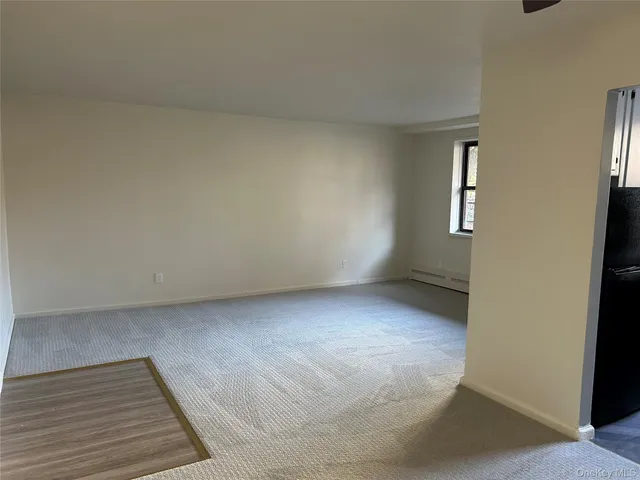 a view of empty room with closet