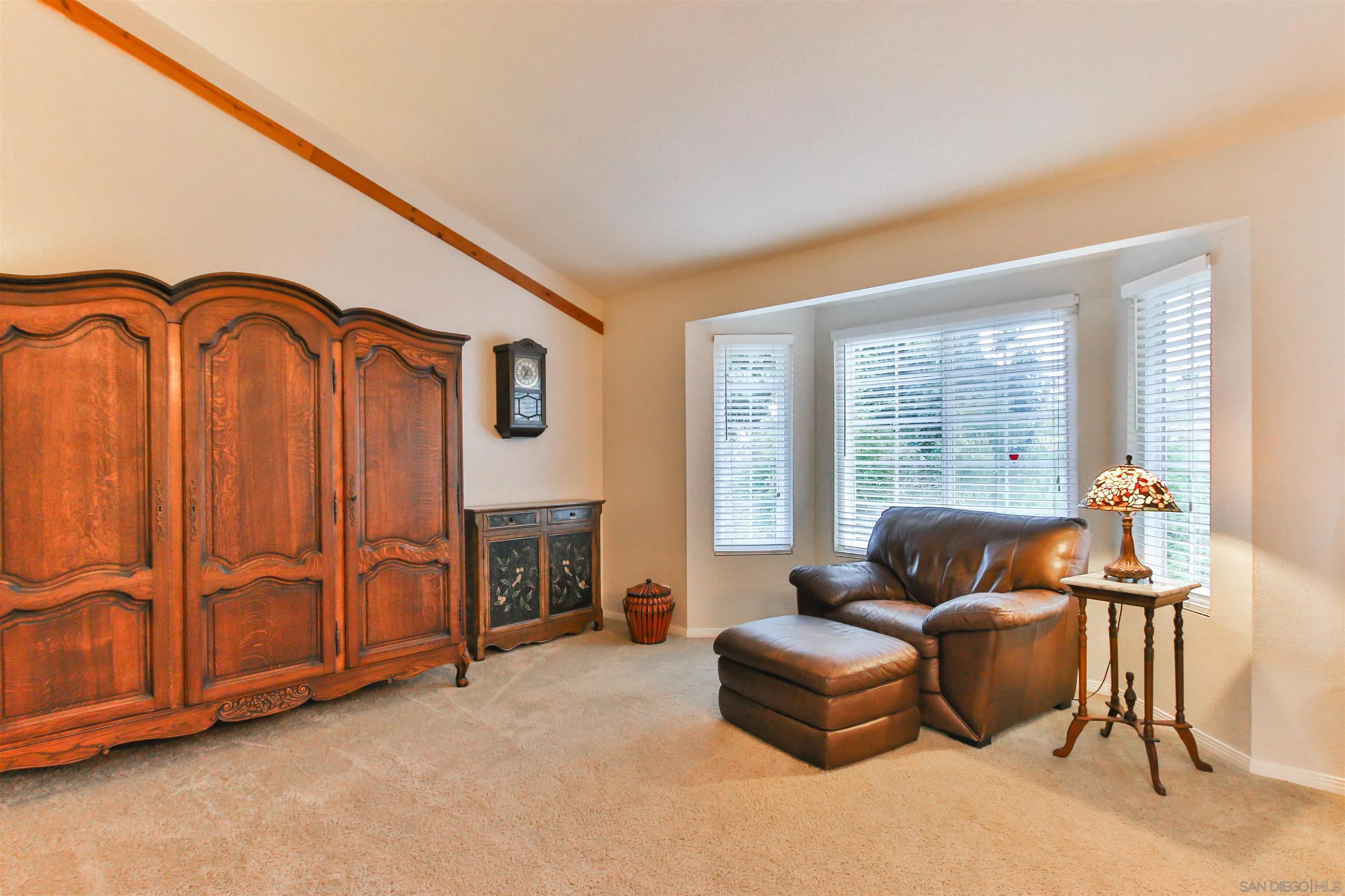 648 Norwynn Lane Fallbrook, CA 92028 - Photo 3 of 17 a living room with furniture a flat screen tv and a window