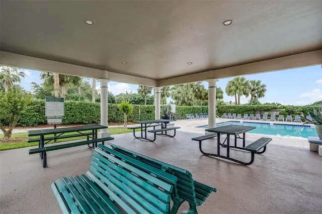 a building outdoor space with patio couches and pool table