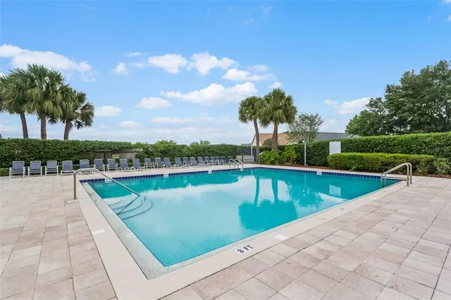 a view of swimming pool with a lounge chair